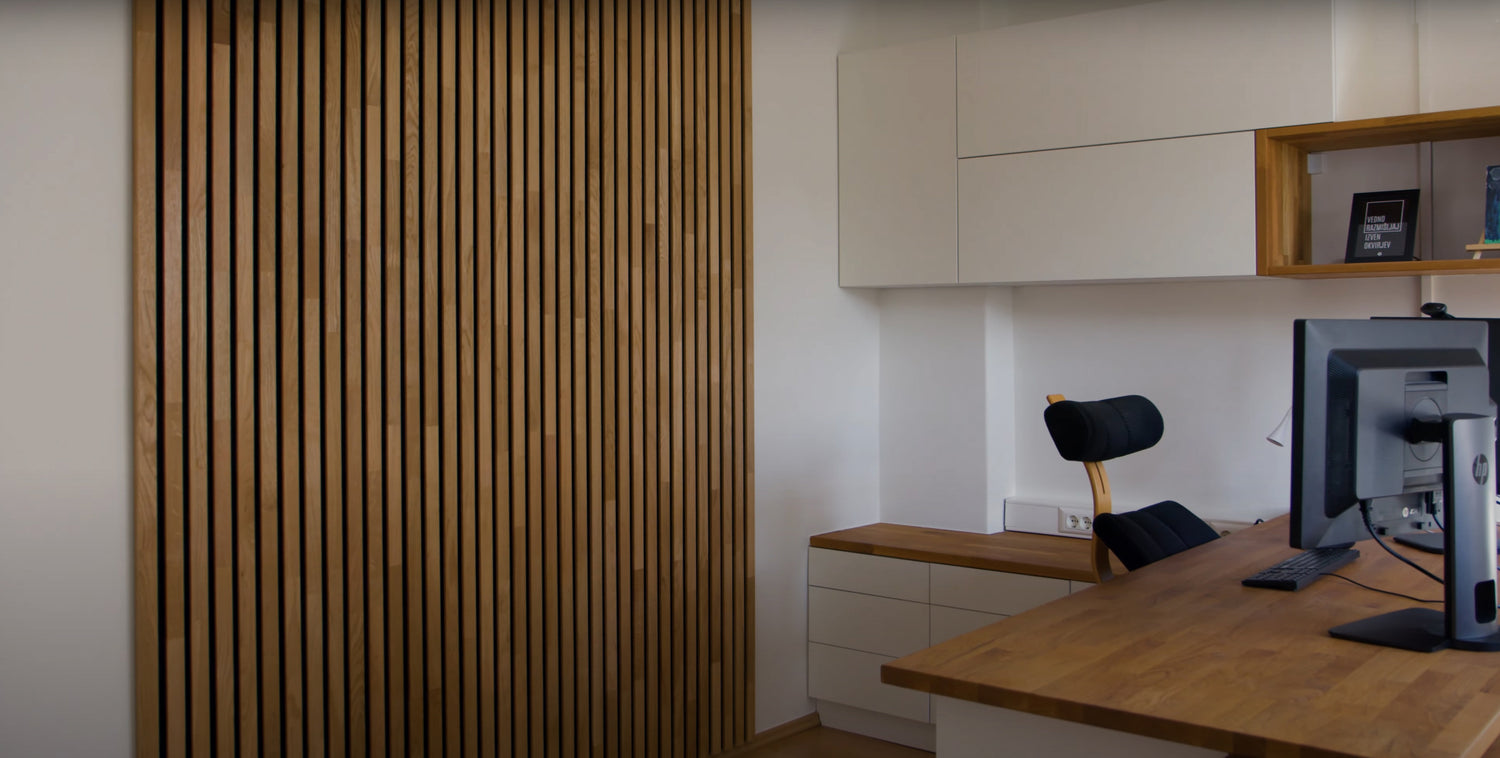 There is acoustic wood wall panel in the study room.