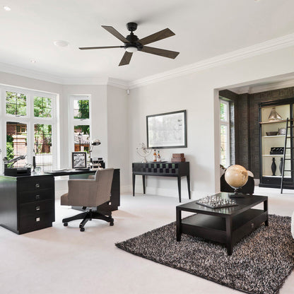 Aspen 52 inch energy efficient ceiling fan with LED light installed in a modern home office. The wood tone 5 blade ceiling fan is mounted on a downrod, complementing the bright contemporary workspace with large windows, black furniture, and neutral décor while providing quiet, high cfm airflow for everyday comfort.  